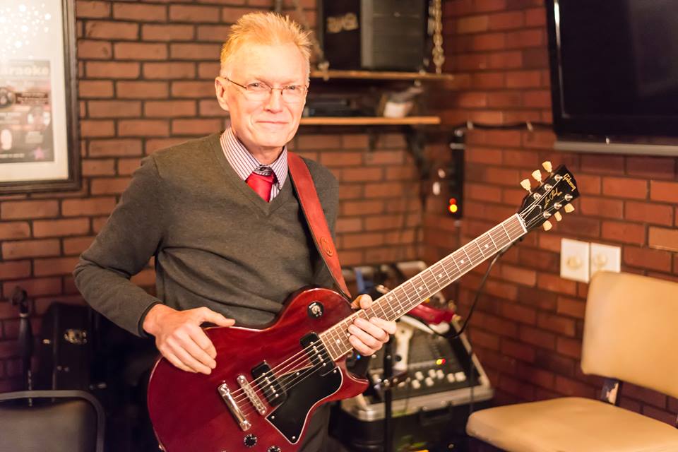 John Murphy with an electric guitar